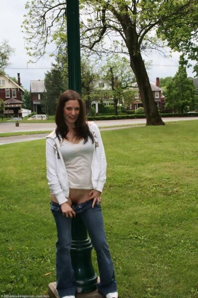 Teen Holly flashing in a park